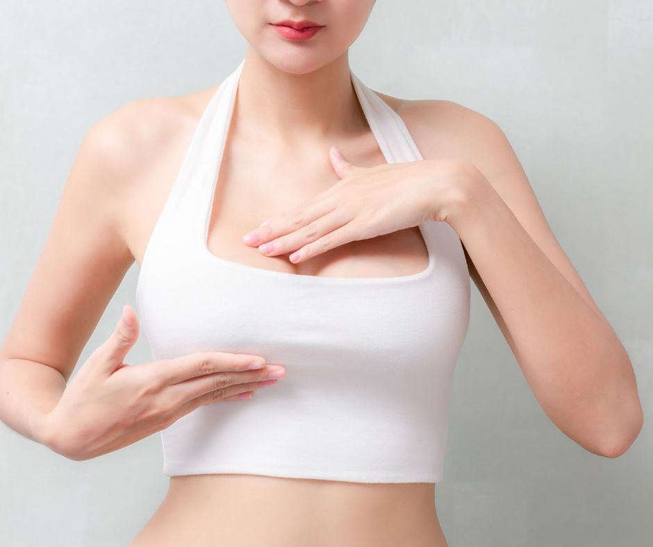 Woman-Gently-Touching-Her-Breast